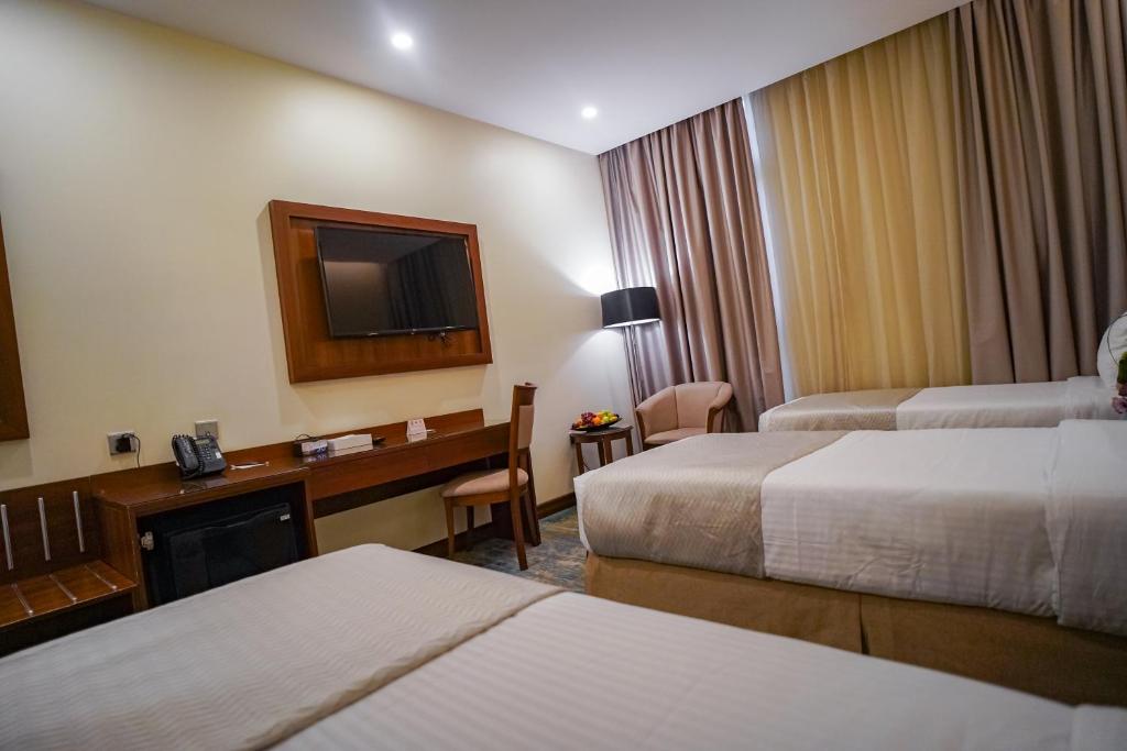 Voodi või voodid majutusasutuse Emaar Elite Hotel toas