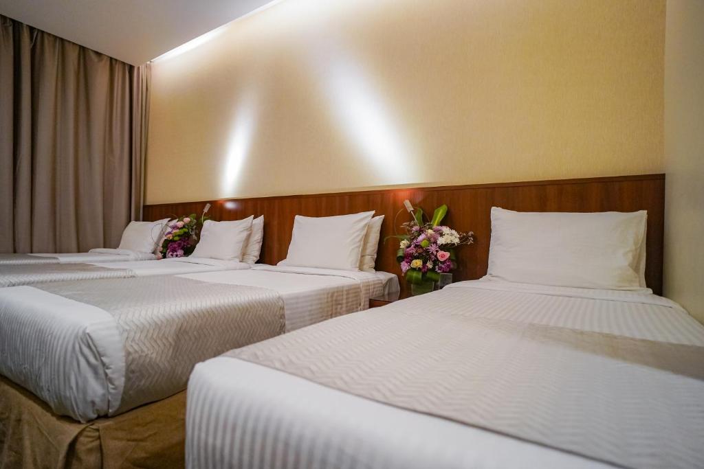 Voodi või voodid majutusasutuse Emaar Elite Hotel toas