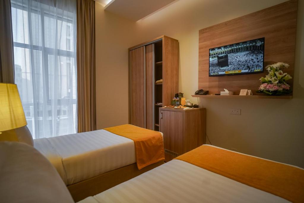 Postel nebo postele na pokoji v ubytování Worth Elite Hotel