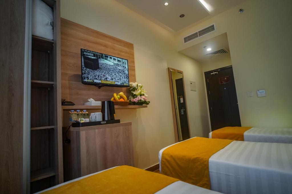 Postel nebo postele na pokoji v ubytování Worth Elite Hotel