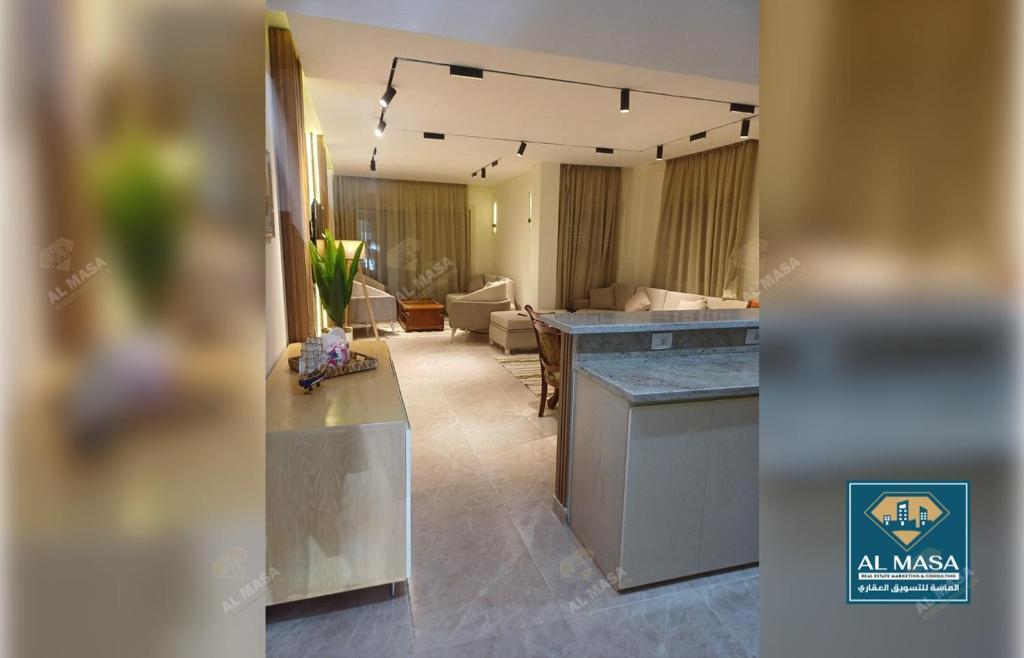 a room with a kitchen and a living room at للايجار ايام الصيف فيلا فاخره بستيلا هايتس - الساحل الشمالي in El Alamein