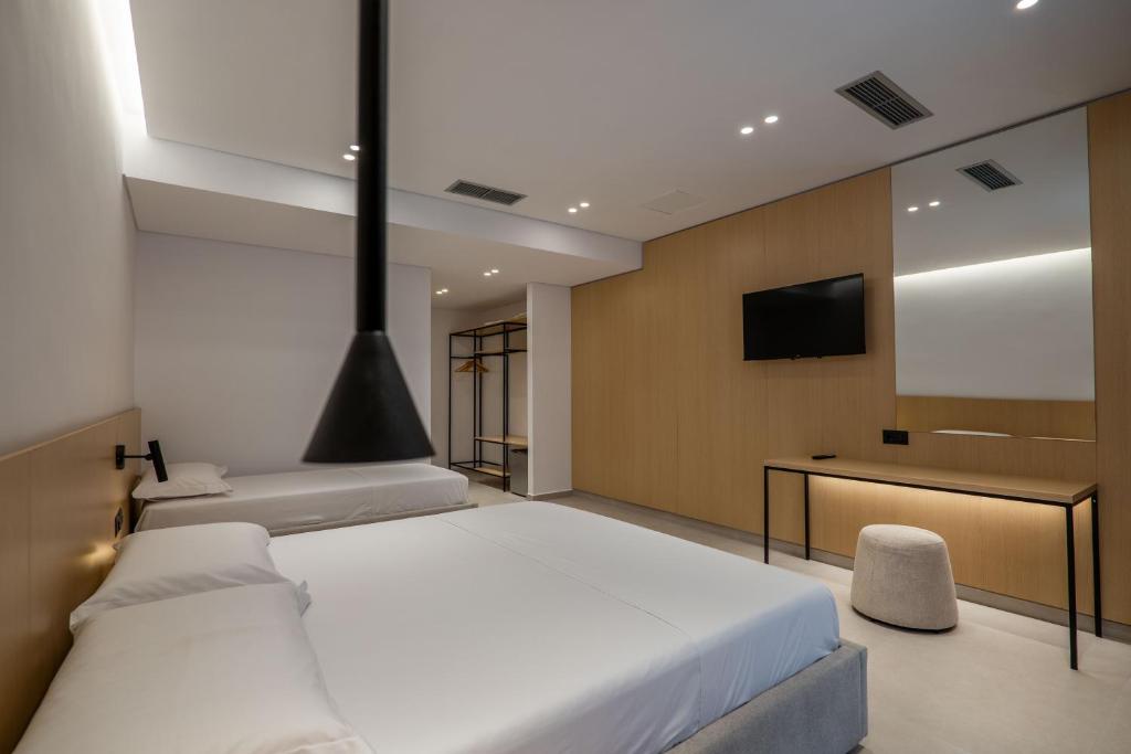 Postel nebo postele na pokoji v ubytování Austin Boutique Hotel
