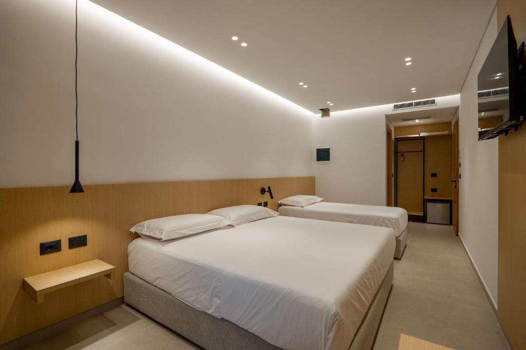 Postel nebo postele na pokoji v ubytování Austin Boutique Hotel