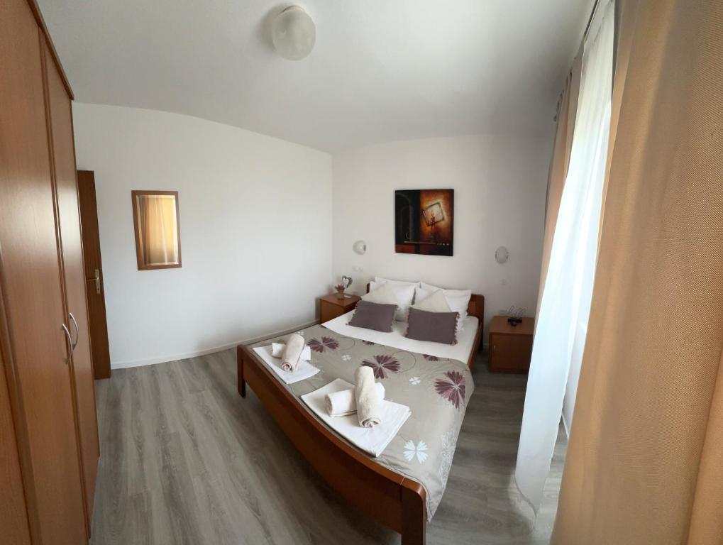 Postel nebo postele na pokoji v ubytování Apartments Oxygen