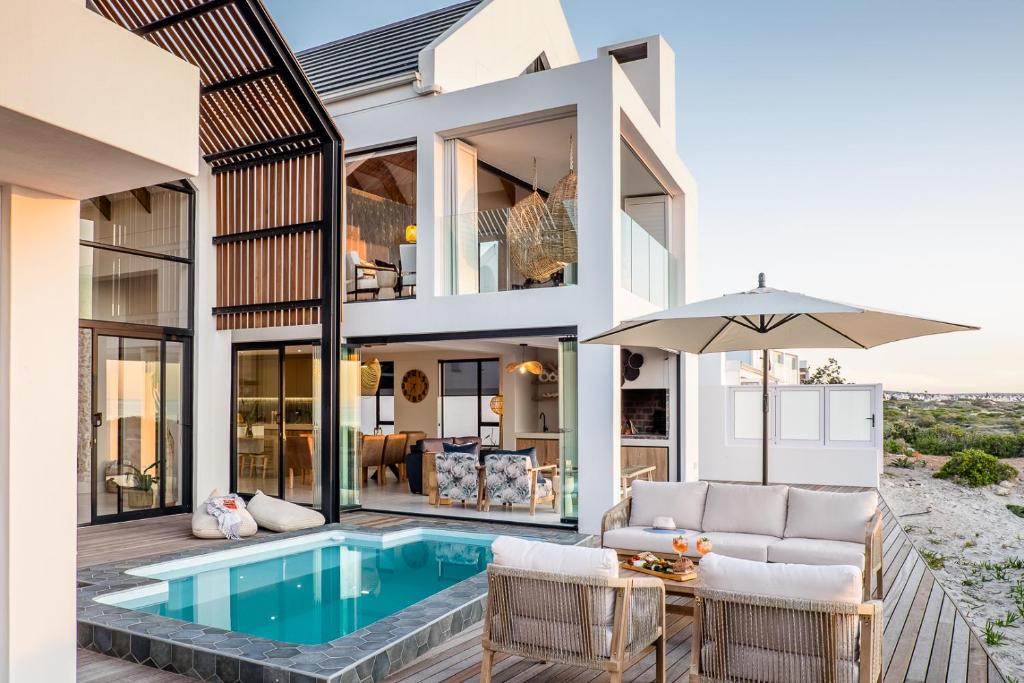 an image of a house with a pool at Thalassophile Beach House in St Helena Bay