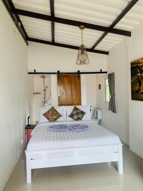 Postel nebo postele na pokoji v ubytování The Summer House Samui