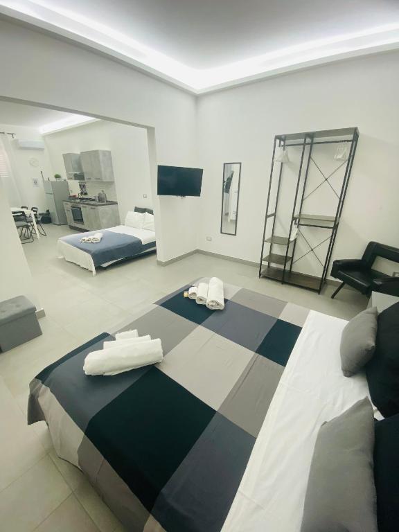 Postel nebo postele na pokoji v ubytování Sicilian Rooms
