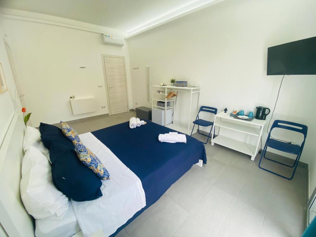 Postel nebo postele na pokoji v ubytování Sicilian Rooms