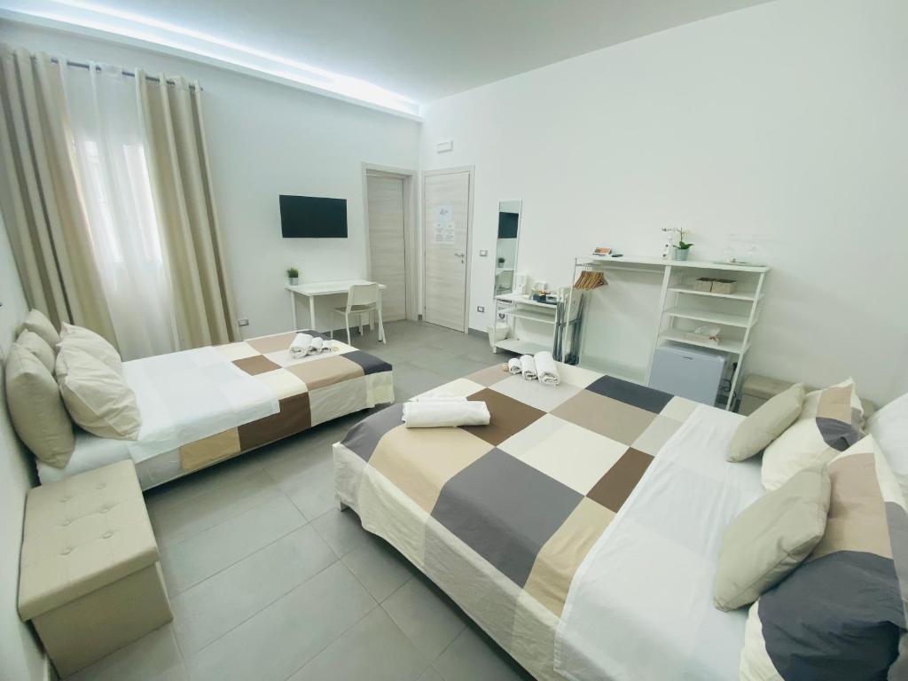 Postel nebo postele na pokoji v ubytování Sicilian Rooms