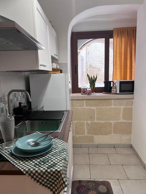 A kitchen or kitchenette at La Cantina Guest House