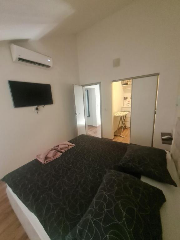 Posteľ alebo postele v izbe v ubytovaní Luxury apartment Duće with private pool