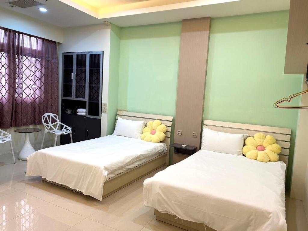Katil atau katil-katil dalam bilik di Kinmen Harved B&B