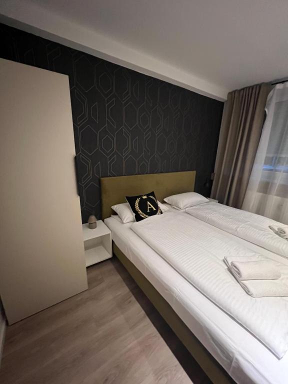 Postel nebo postele na pokoji v ubytování Alpha Rooms
