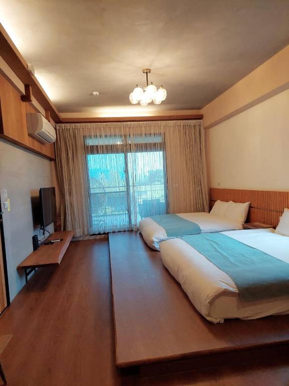 Postel nebo postele na pokoji v ubytování Jiaoxi Pusu Homestay