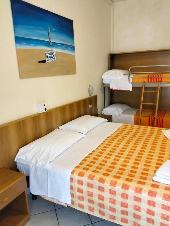 Postel nebo postele na pokoji v ubytování Albergo Rosa & Cosetta