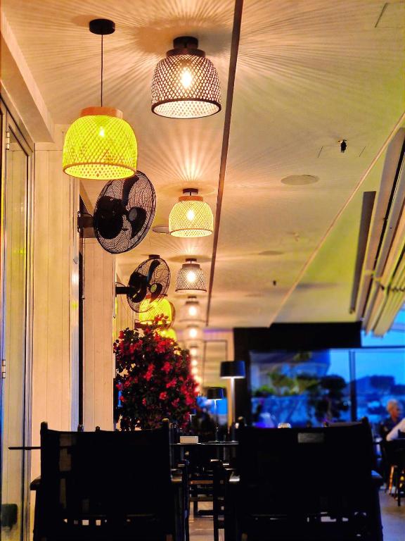 a dining room with a christmas tree in a restaurant at The Ciao Stelio Deluxe Boutique Hotel - Adults Only in Larnaka