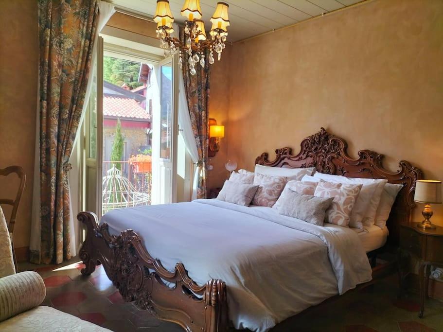 Postel nebo postele na pokoji v ubytování Villa Costanza Appartamento con balcone e vista giardino