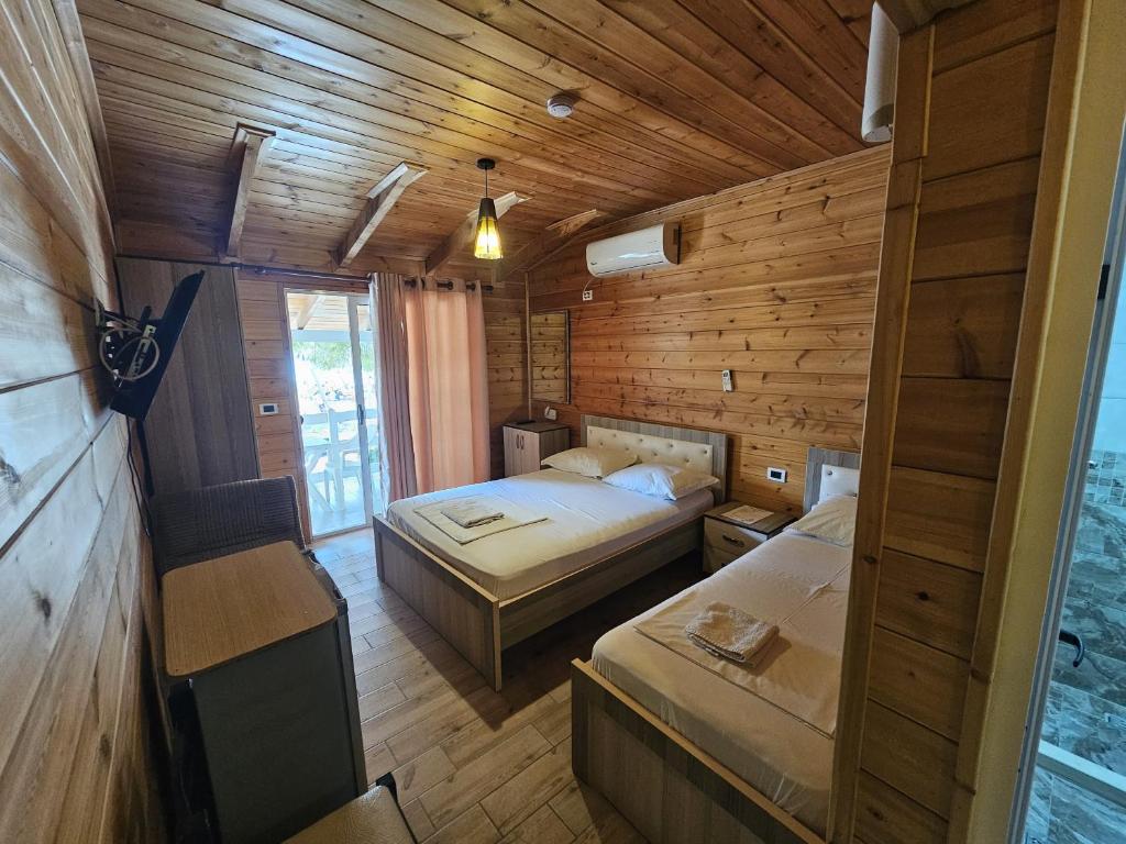 Postel nebo postele na pokoji v ubytování Bujtina e Zefit