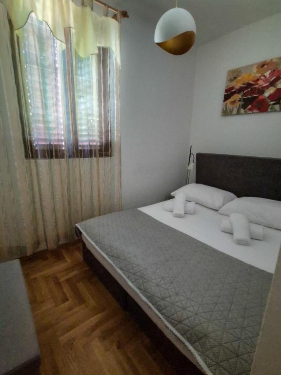Postel nebo postele na pokoji v ubytování Apartments and pansion M&R