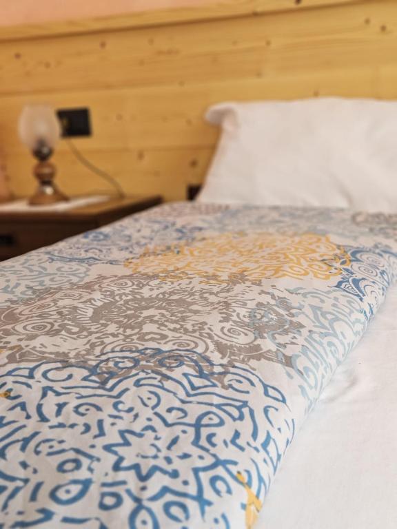 Postel nebo postele na pokoji v ubytování Hotel Miravalle