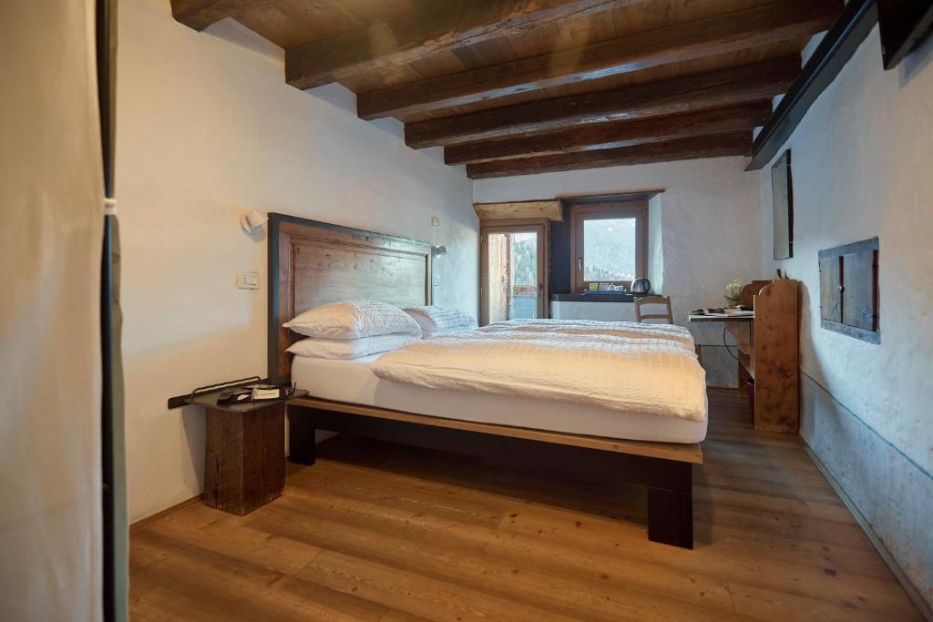 Postel nebo postele na pokoji v ubytování Dormì & Disnà