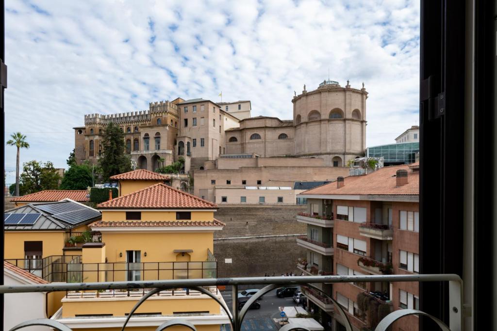 a view of a large castle from a window at Sistine Chapel View Rooms Check-in From 3 Pm To 10 Pm in Rome