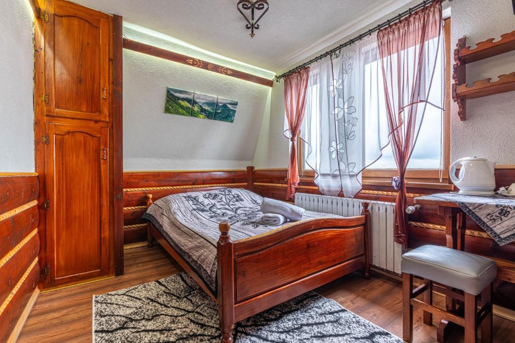 Postel nebo postele na pokoji v ubytování Dom Wypoczynkowy Wierchy