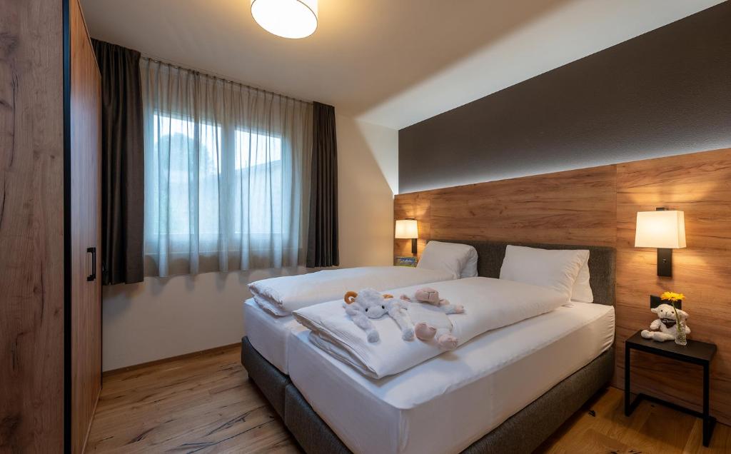 Postel nebo postele na pokoji v ubytování Pradas Resort Brigels