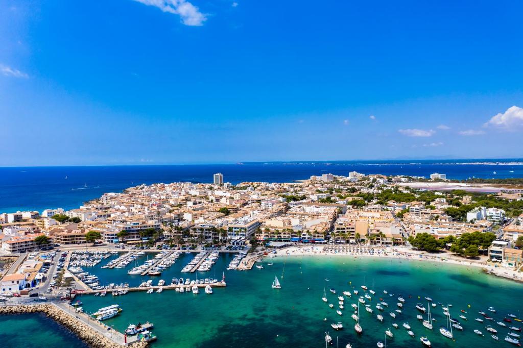 an aerial view of a harbor with boats in the water at Casa Sasera in Colonia Sant Jordi