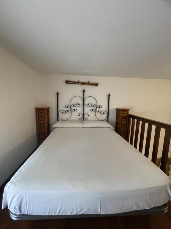 Postel nebo postele na pokoji v ubytování La Hacienda del Marquesado