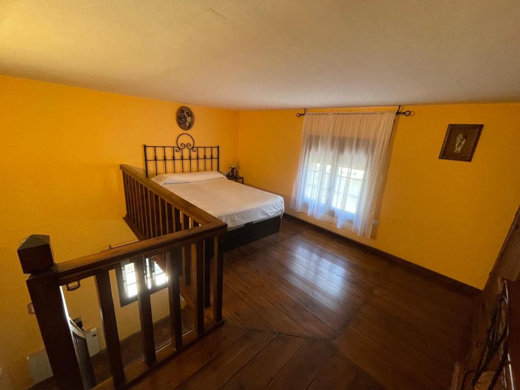 Postel nebo postele na pokoji v ubytování La Hacienda del Marquesado