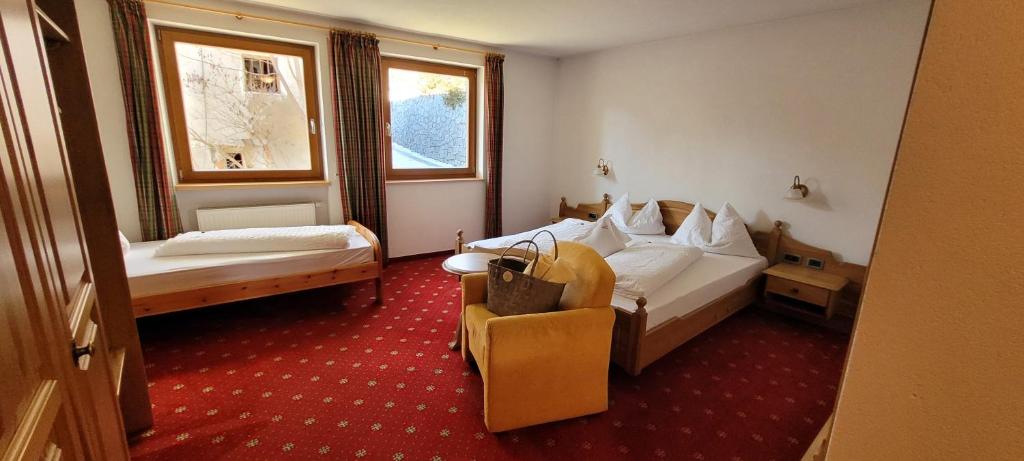 Postel nebo postele na pokoji v ubytování Hotel Tonnerhof