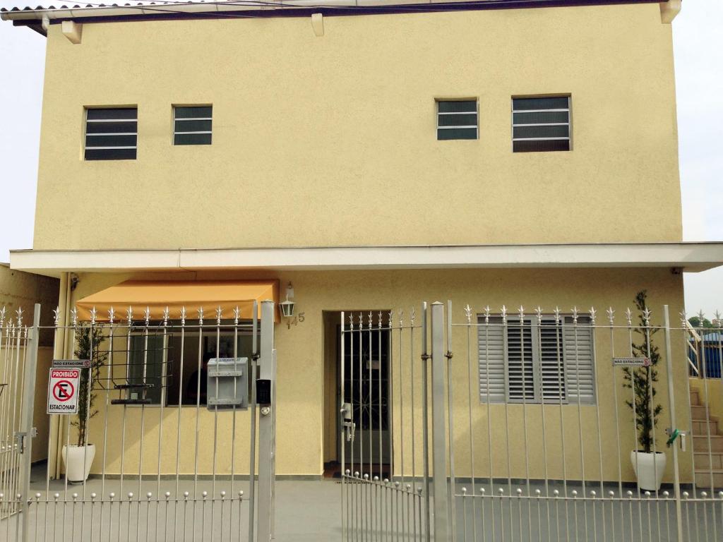 a building with a gate in front of it at Residence Barueri in Barueri