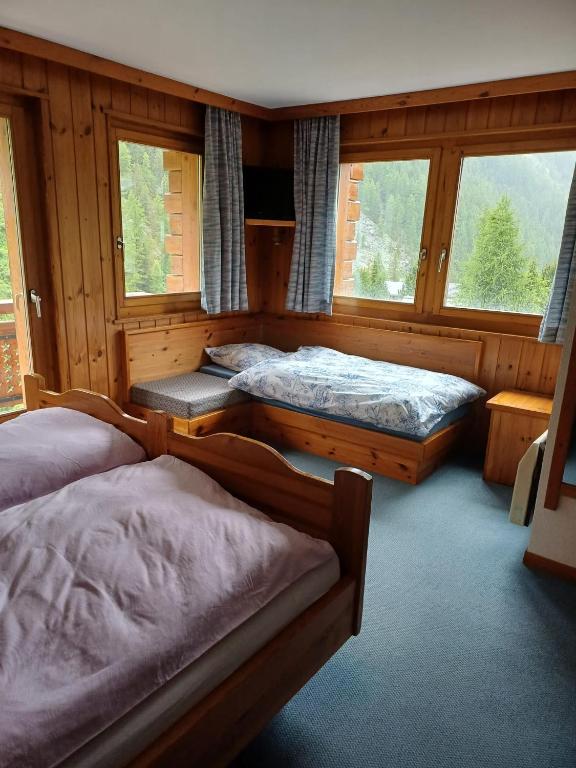 Voodi või voodid majutusasutuse Hôtel Garni Les Bouquetins toas