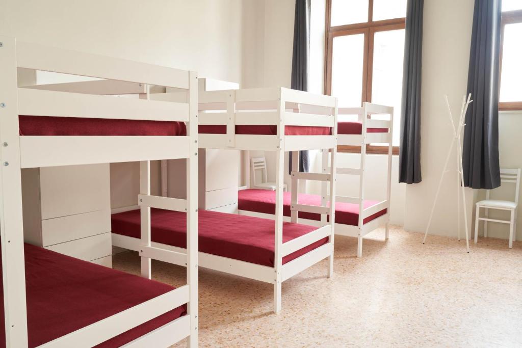 Postel nebo postele na pokoji v ubytování HUB Portanova