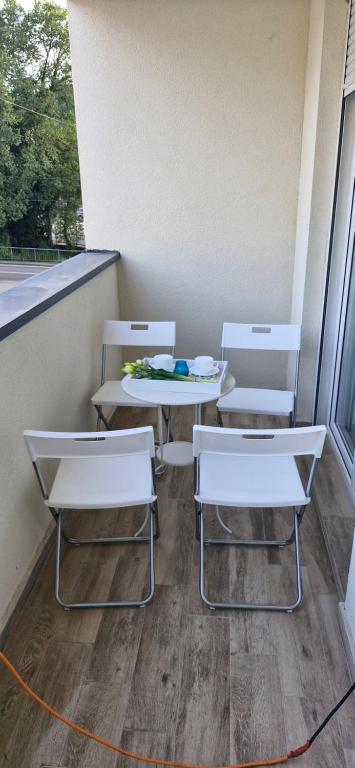 two chairs and a table and two tables and chairs at Zira2 in Kotor