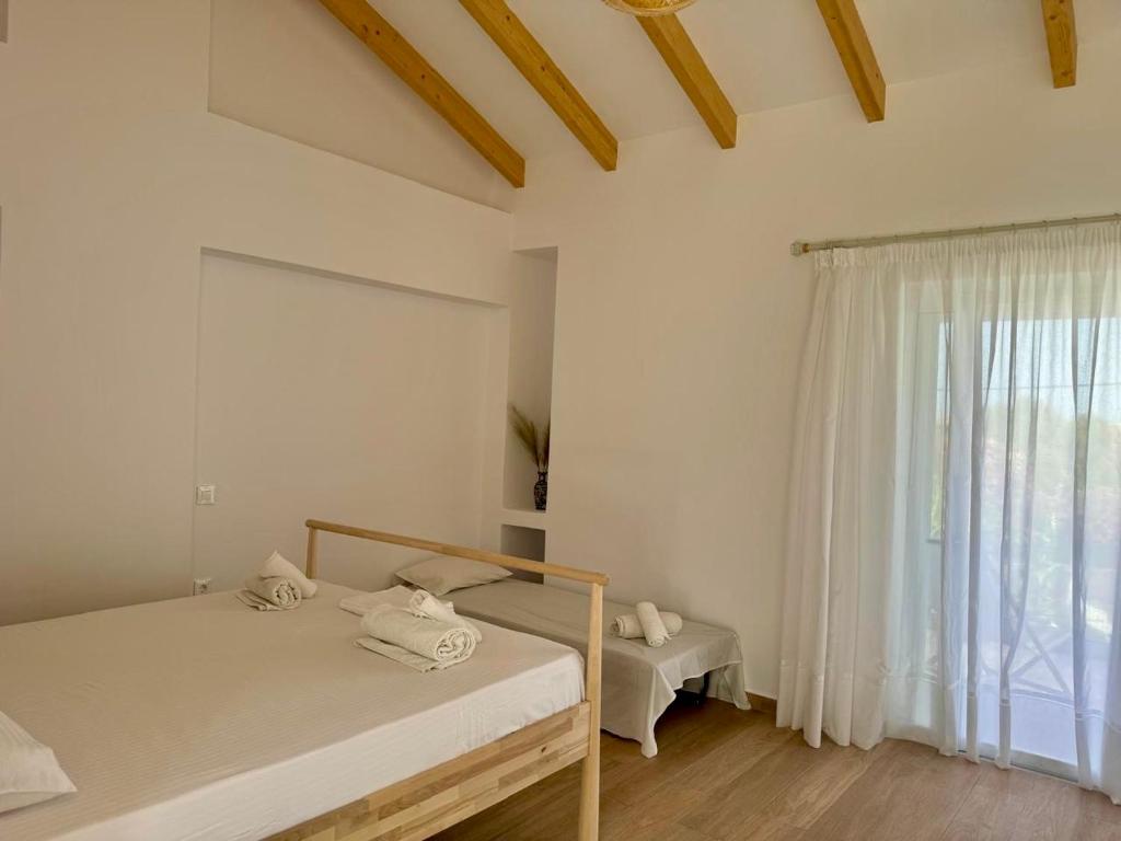 Postel nebo postele na pokoji v ubytování NikLuDin suites & studios