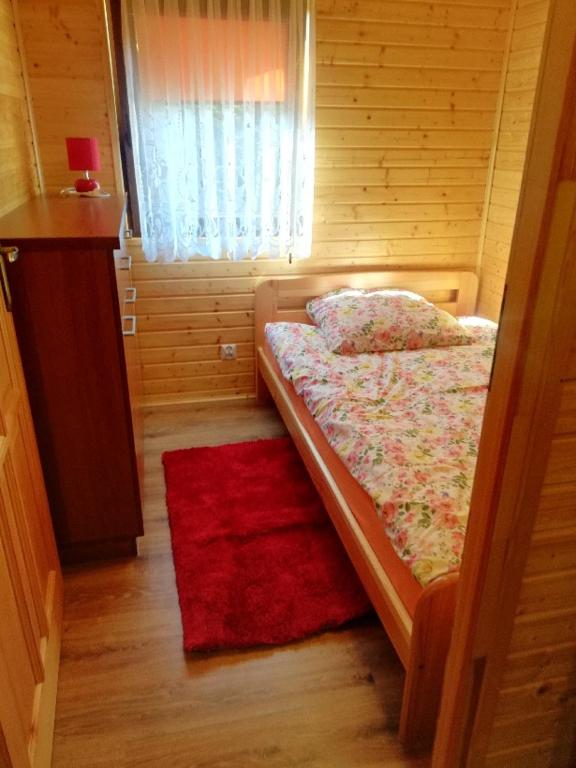 Postel nebo postele na pokoji v ubytování Ośrodek Wypoczynkowy "Słoneczko"