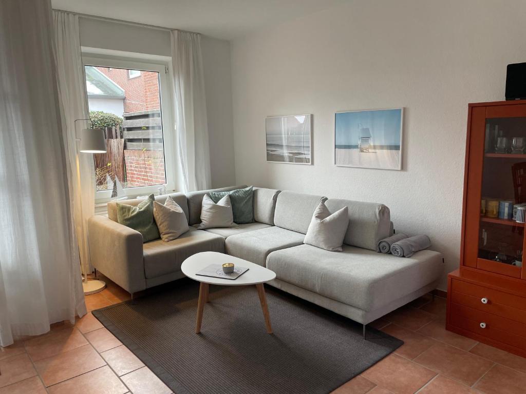 a living room with a couch and a table at Sandbank in Langeoog