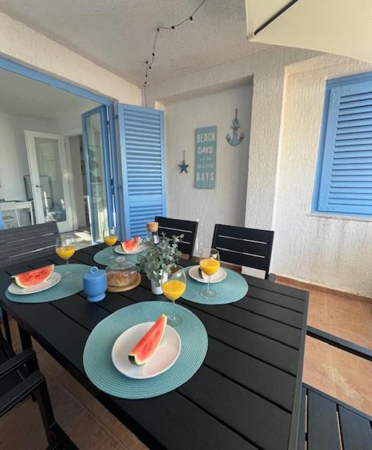 a table with plates of food on top of it at SeaFun Apartment Gajac in Gajac