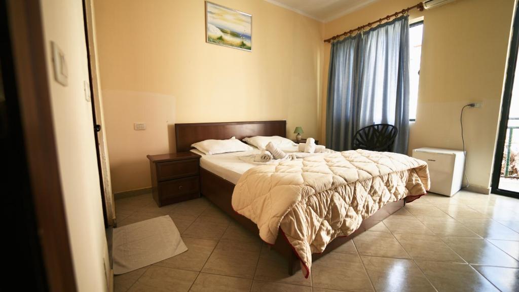 Postel nebo postele na pokoji v ubytování Sanremo Hotel Restorant
