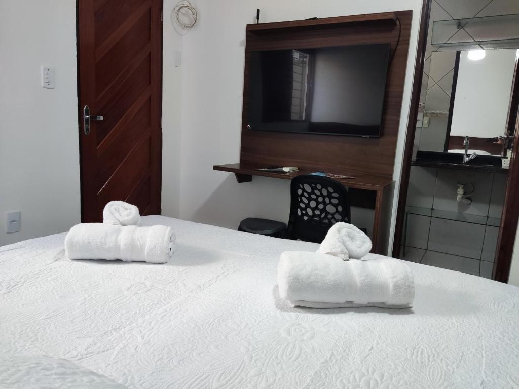 Voodi või voodid majutusasutuse E e J residência à 200 metros da praia do Bessa toas