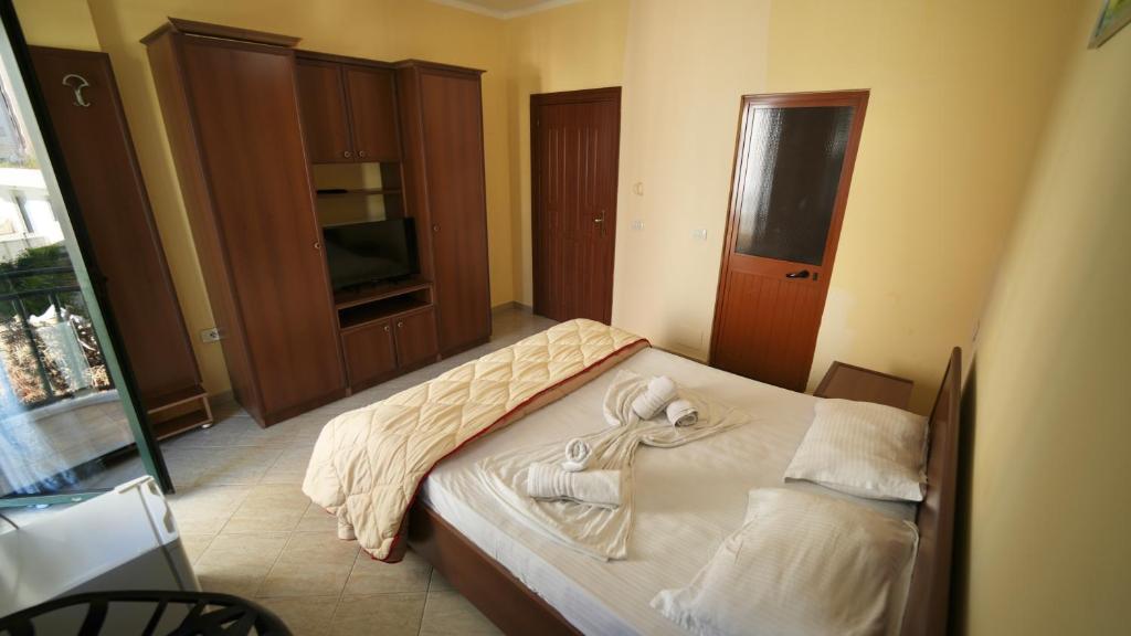 Postel nebo postele na pokoji v ubytování Sanremo Hotel Restorant