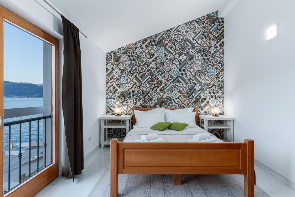 Postel nebo postele na pokoji v ubytování Villas Plitka