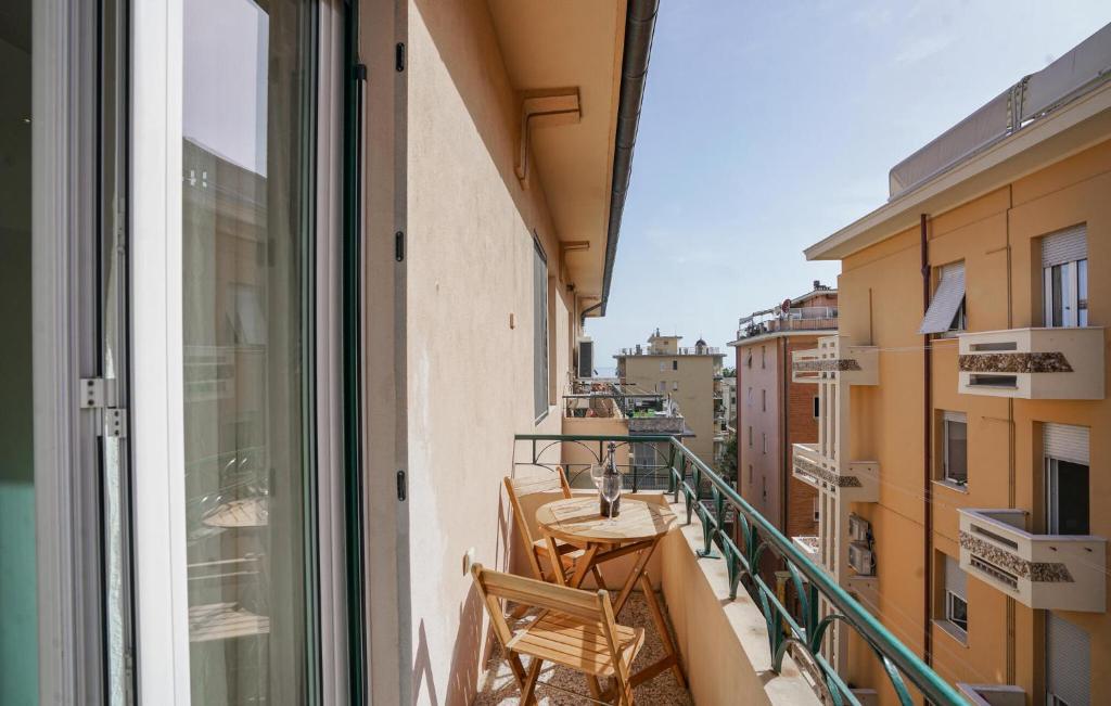 a balcony with a table and chairs on a balcony at Amazing Apartment In Chiavari With Wifi in Chiavari