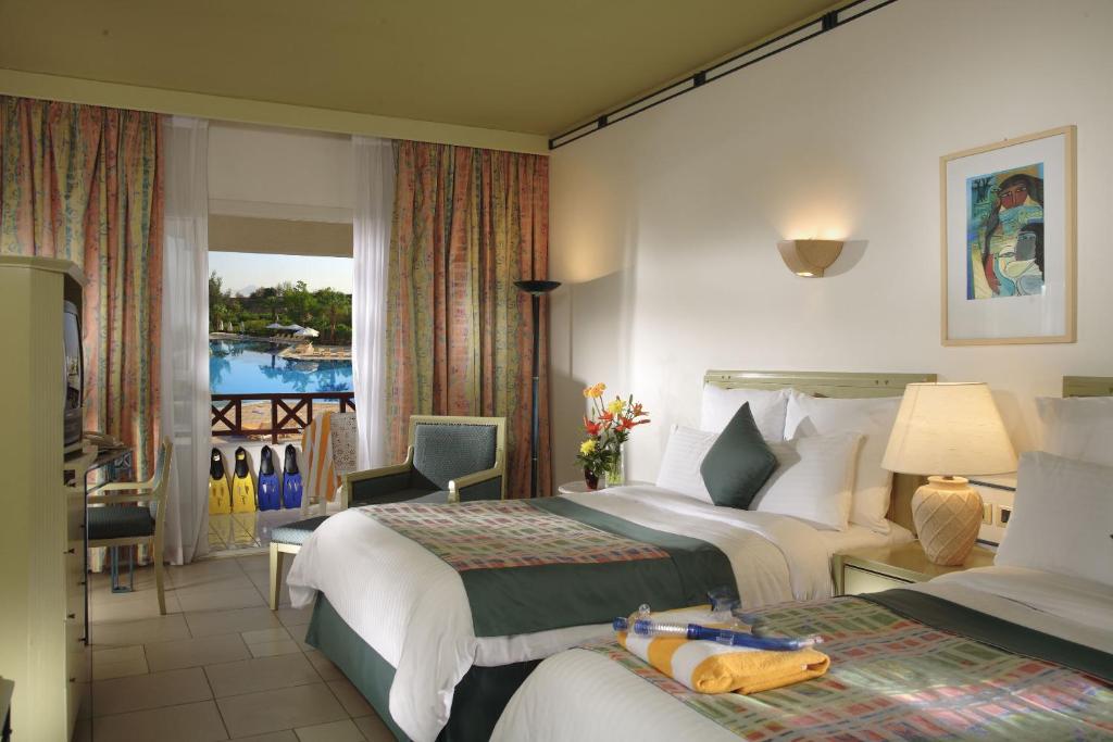 Postel nebo postele na pokoji v ubytování Naama Bay Promenade Beach Resort Managed By Accor