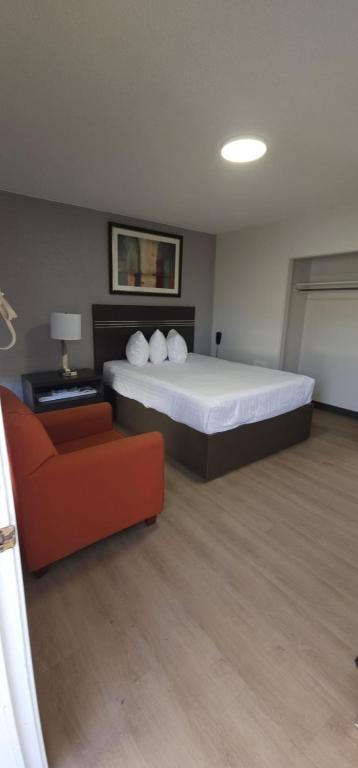 Postel nebo postele na pokoji v ubytování Riverside Motel