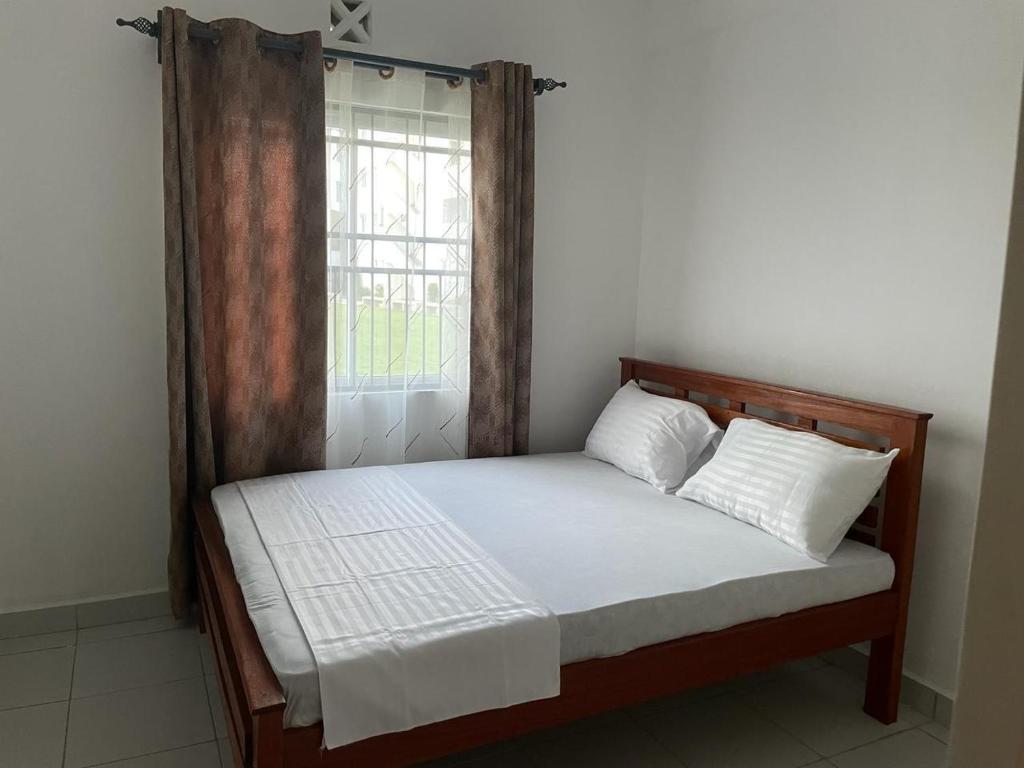 Ένα ή περισσότερα κρεβάτια σε δωμάτιο στο She-goes apartments