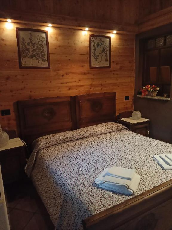 Letto o letti in una camera di L'Alpina Affittacamere