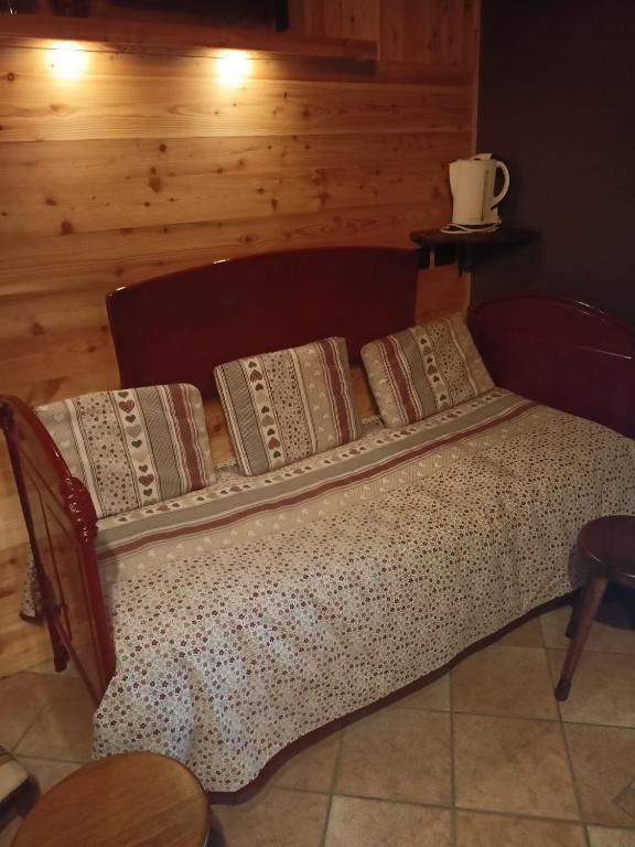 Letto o letti in una camera di L'Alpina Affittacamere